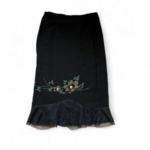 Black midi skirt with flowers and glitter ruffle hem